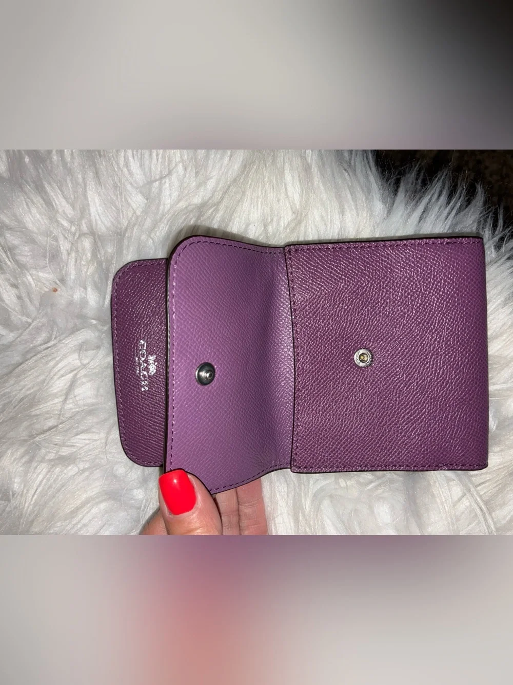 Coach Compact Trifold Pebbled Leather Wallet button closure in Plum/Purple.